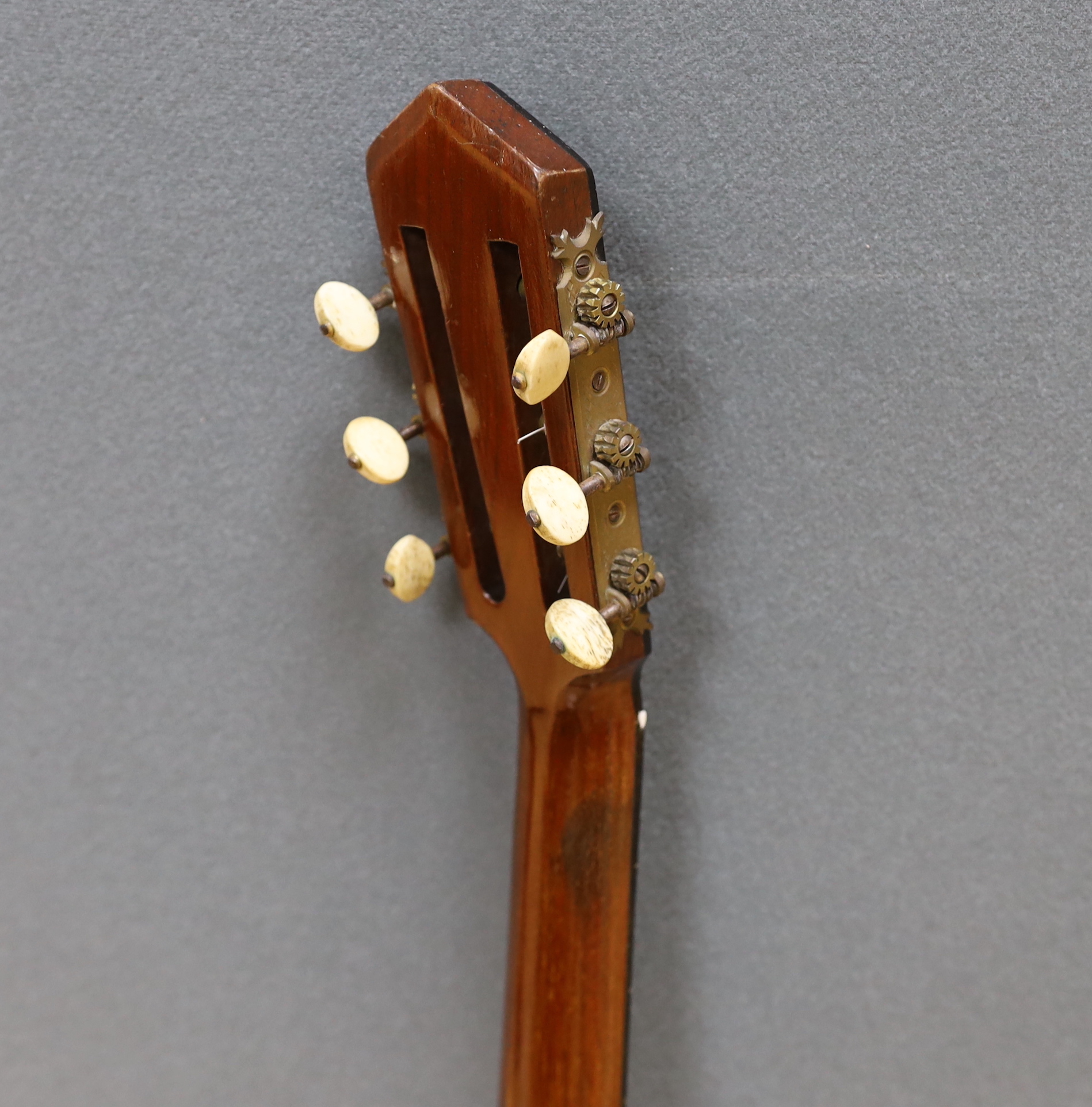 A six string banjo, unmarked, in a hard case by Ashbury